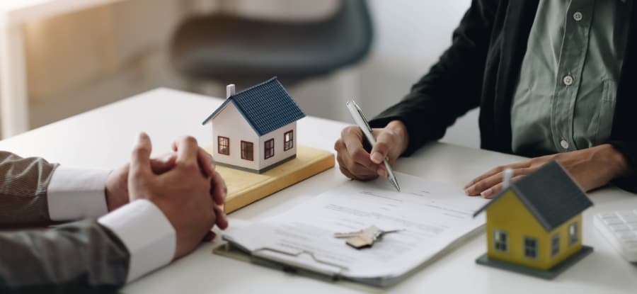Close image of homebuyer completing financial documents