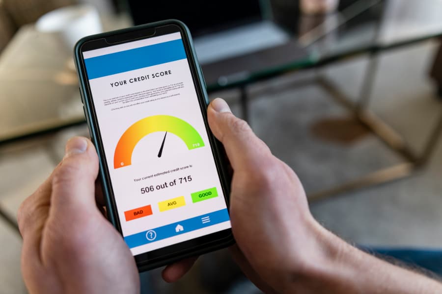 Person using smartphone to check credit score