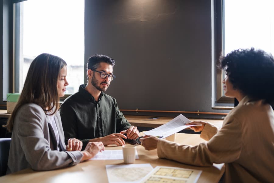 Young couple meeting with mortgage broker